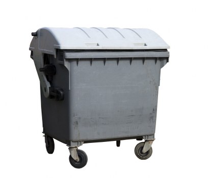 Workers loading waste into a skip hire